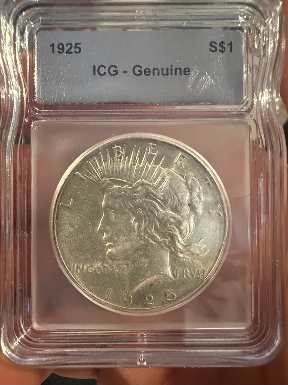 1925 Peace Silver Dollar in ICG Genuine Holder